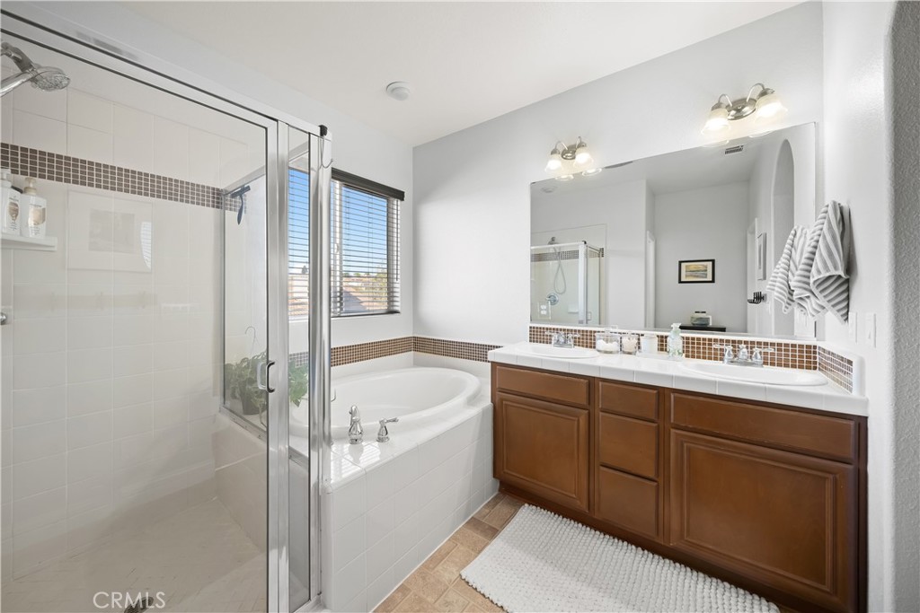 731 Voyager Road Lompoc, CA 93436 - Photo 29 of 57 a bathroom with a tub sink shower and mirror