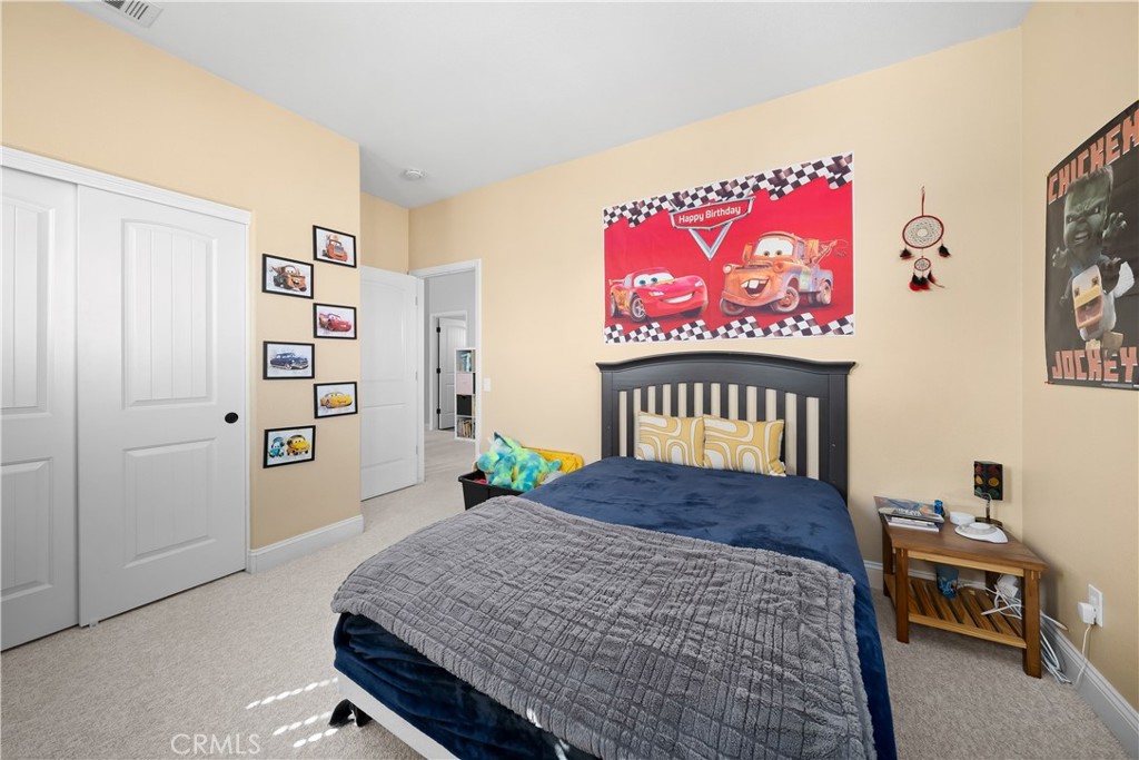 731 Voyager Road Lompoc, CA 93436 - Photo 36 of 57 a bedroom with a bed and a table in it