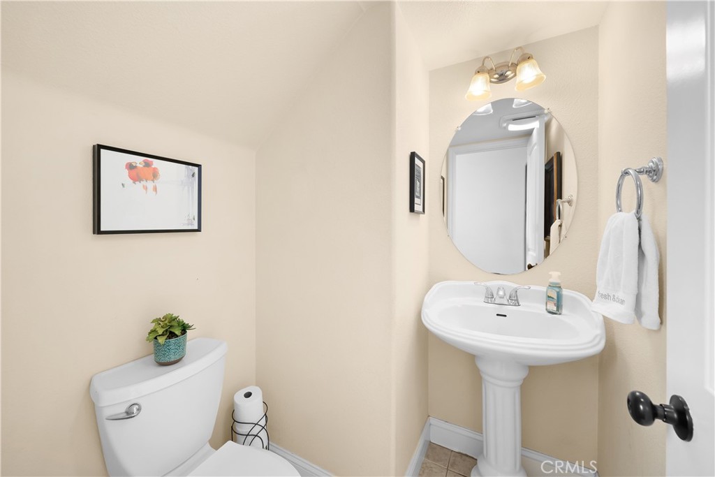 731 Voyager Road Lompoc, CA 93436 - Photo 37 of 57 a bathroom with a toilet sink and mirror