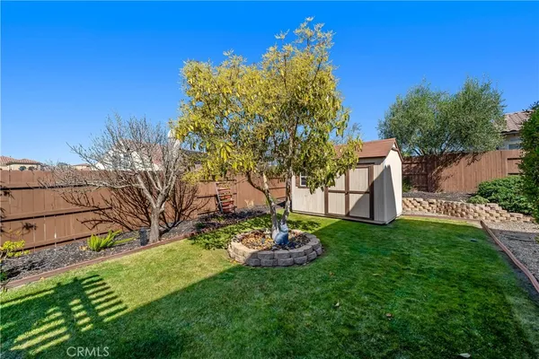 an aerial view of a house with a yard lake view