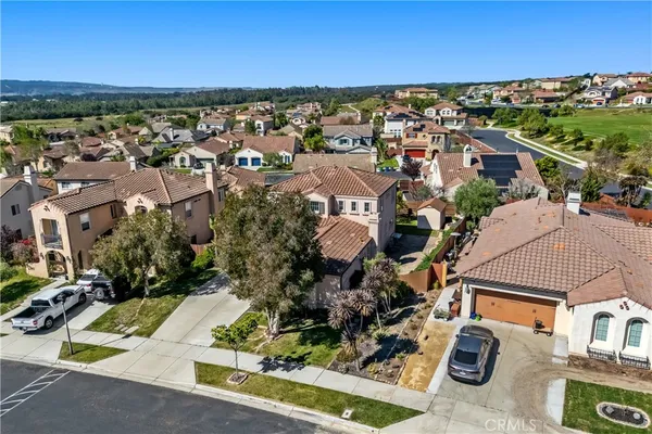 an aerial view of residential houses with outdoor space