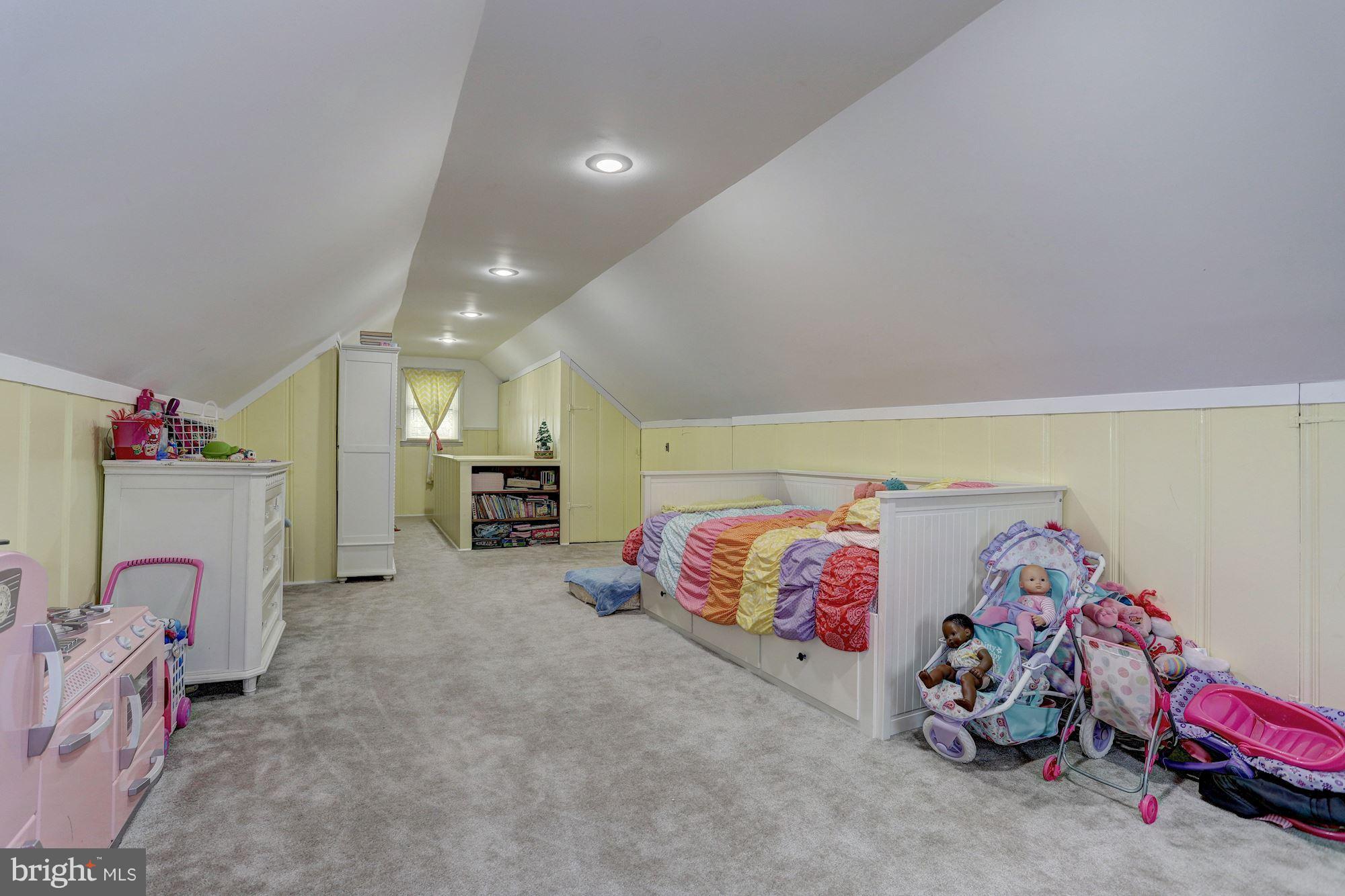 2503 Wendover Road Baltimore, MD 21234 - Photo 13 of 22 a bedroom with a bed and a couch