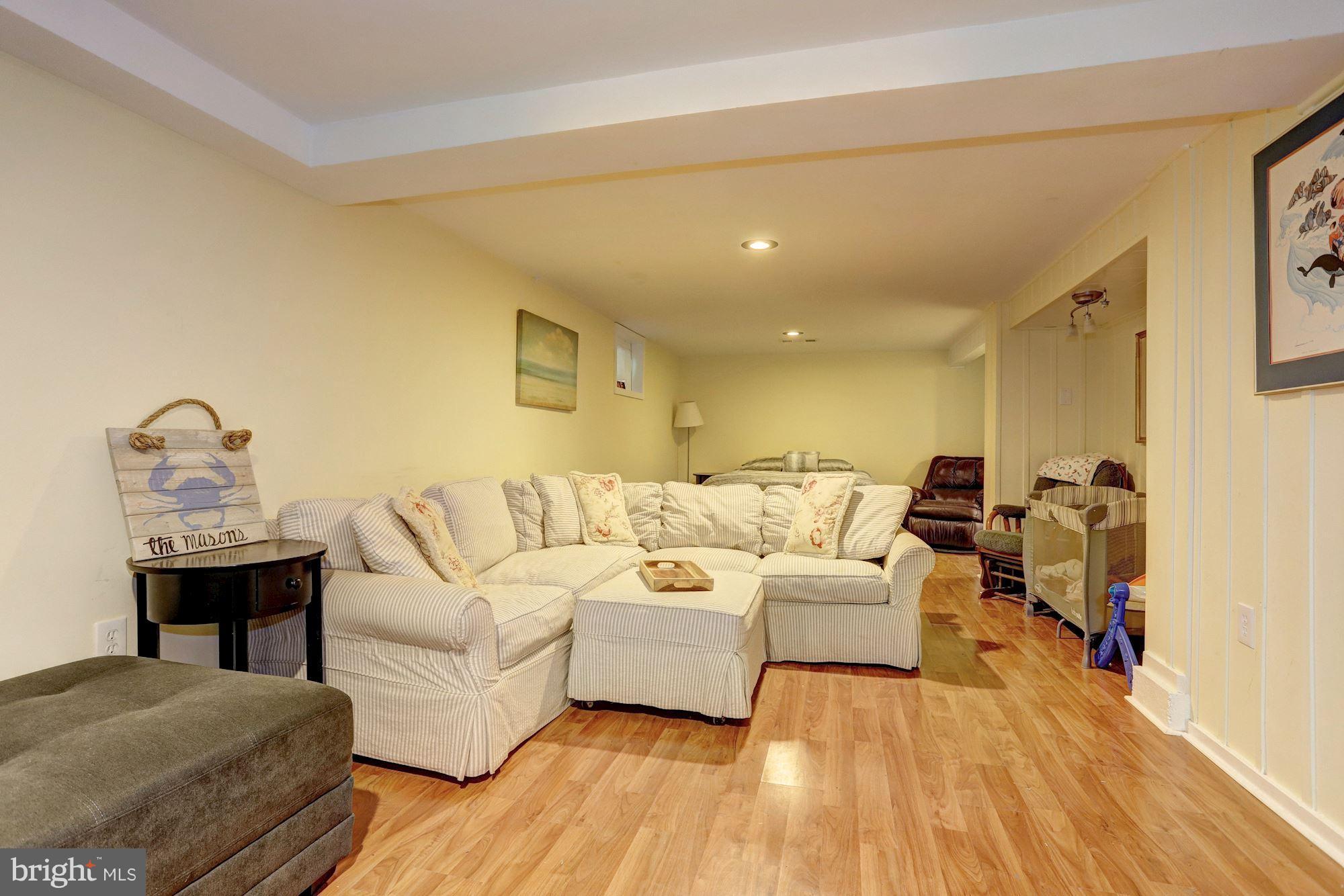 2503 Wendover Road Baltimore, MD 21234 - Photo 16 of 22 a living room with furniture and a wooden floor