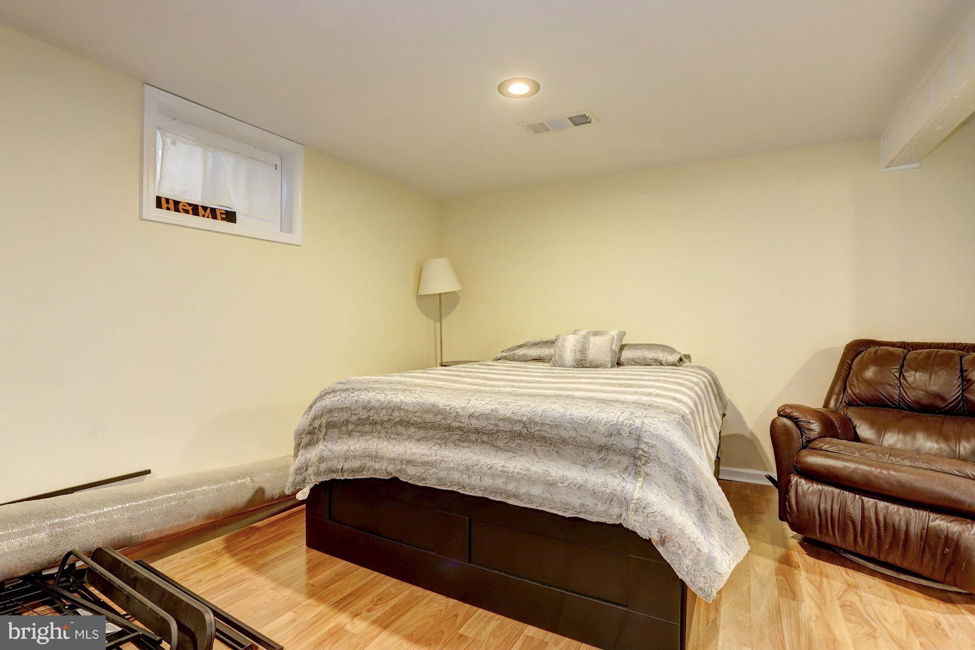 2503 Wendover Road Baltimore, MD 21234 - Photo 18 of 22 a bedroom with a bed and furniture