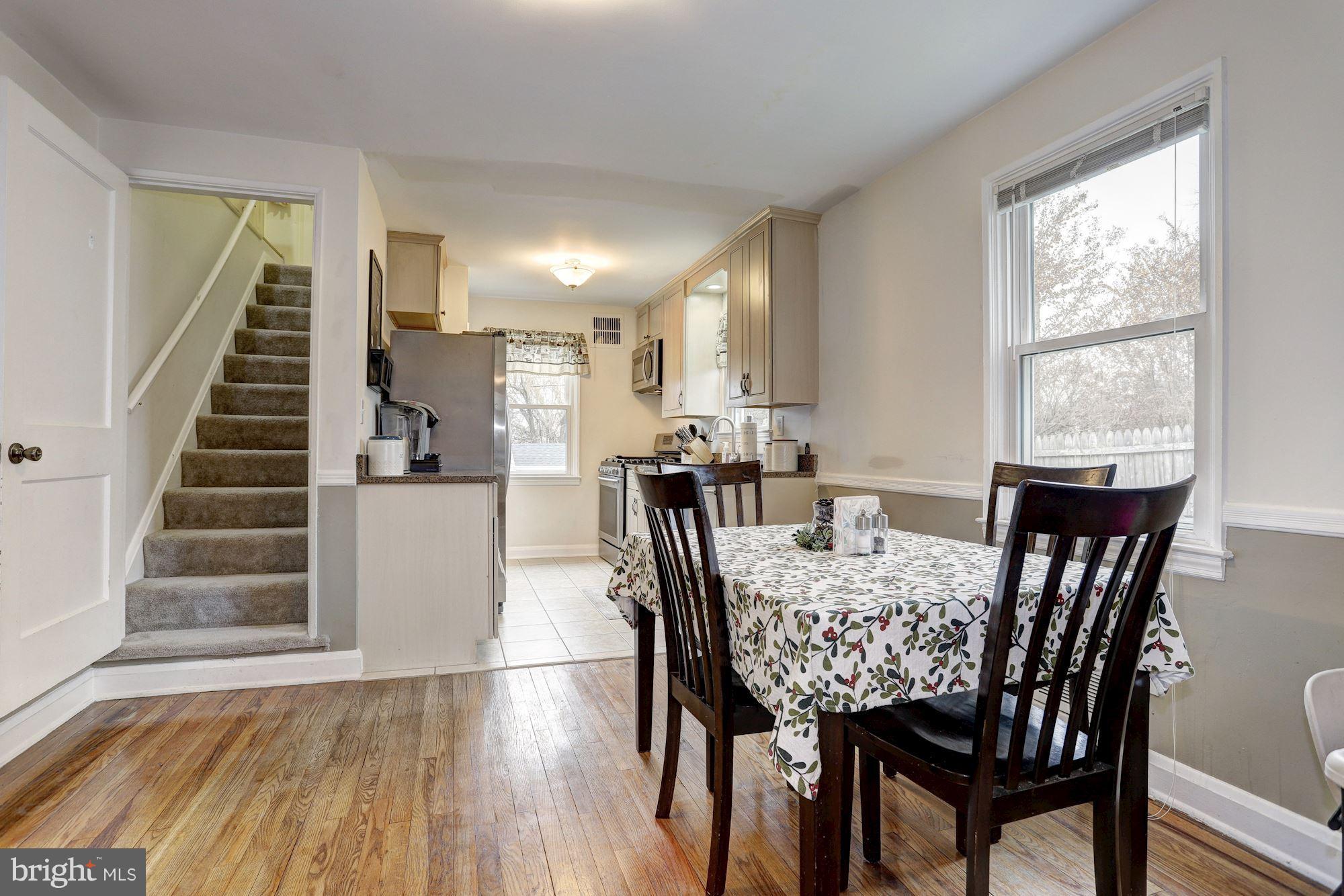 2503 Wendover Road Baltimore, MD 21234 - Photo 4 of 22 a view of a dining room with furniture and wooden floor