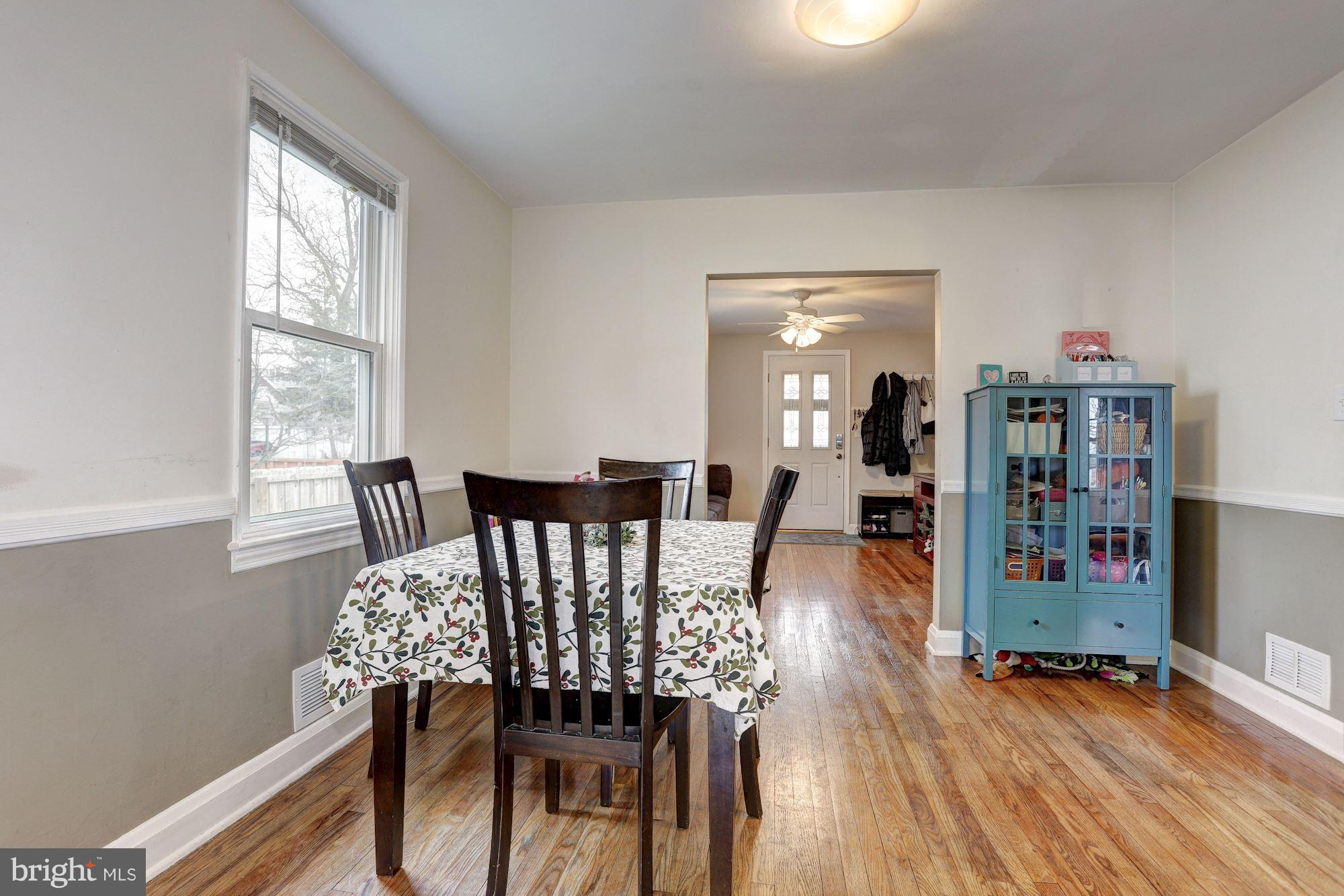 2503 Wendover Road Baltimore, MD 21234 - Photo 5 of 22 a view of a dining room with furniture and wooden floor