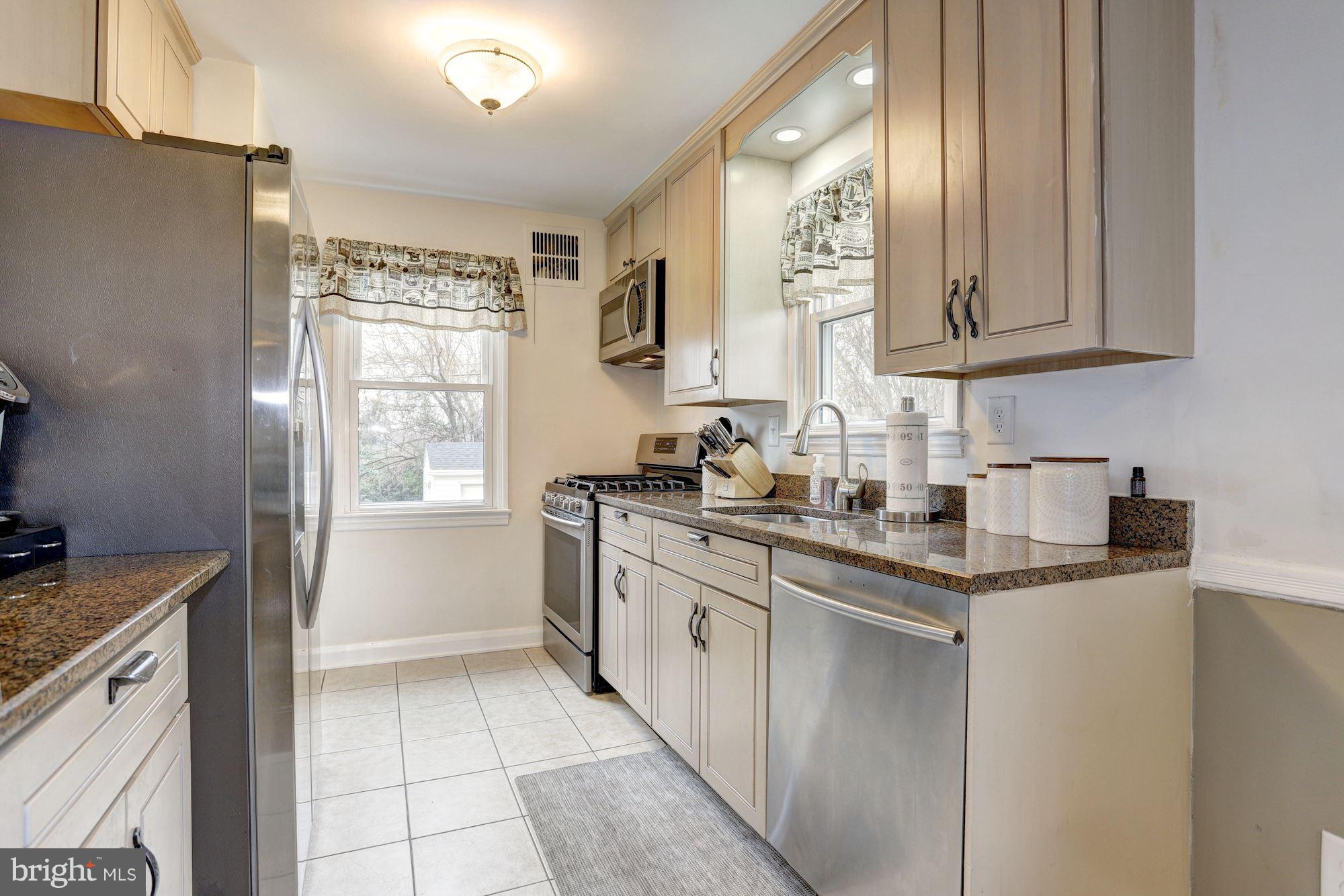 2503 Wendover Road Baltimore, MD 21234 - Photo 6 of 22 a kitchen with a sink cabinets and a window