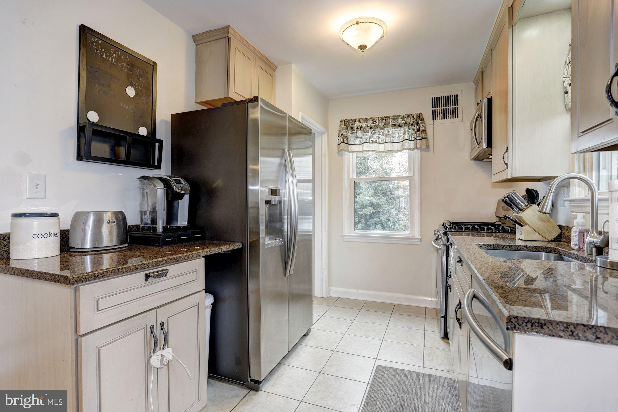 2503 Wendover Road Baltimore, MD 21234 - Photo 7 of 22 a kitchen with a sink stove and refrigerator