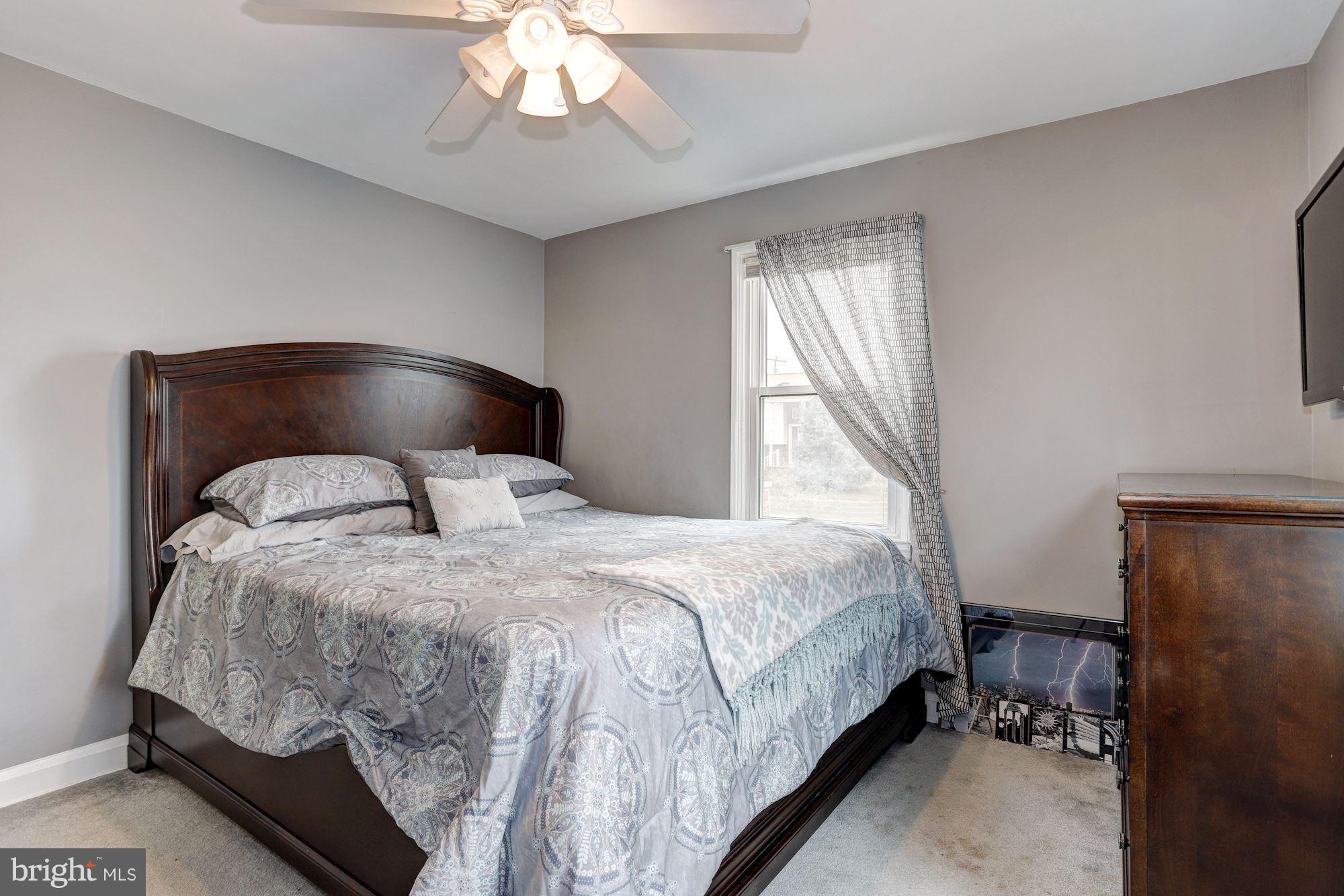 2503 Wendover Road Baltimore, MD 21234 - Photo 9 of 22 a bedroom with a bed and window