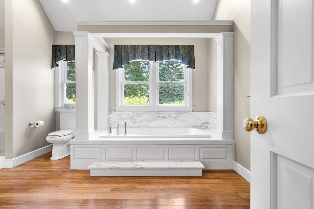 24 Whitney Road Boxford, MA 01921 - Photo 24 of 42 a bathroom with a bathtub and window