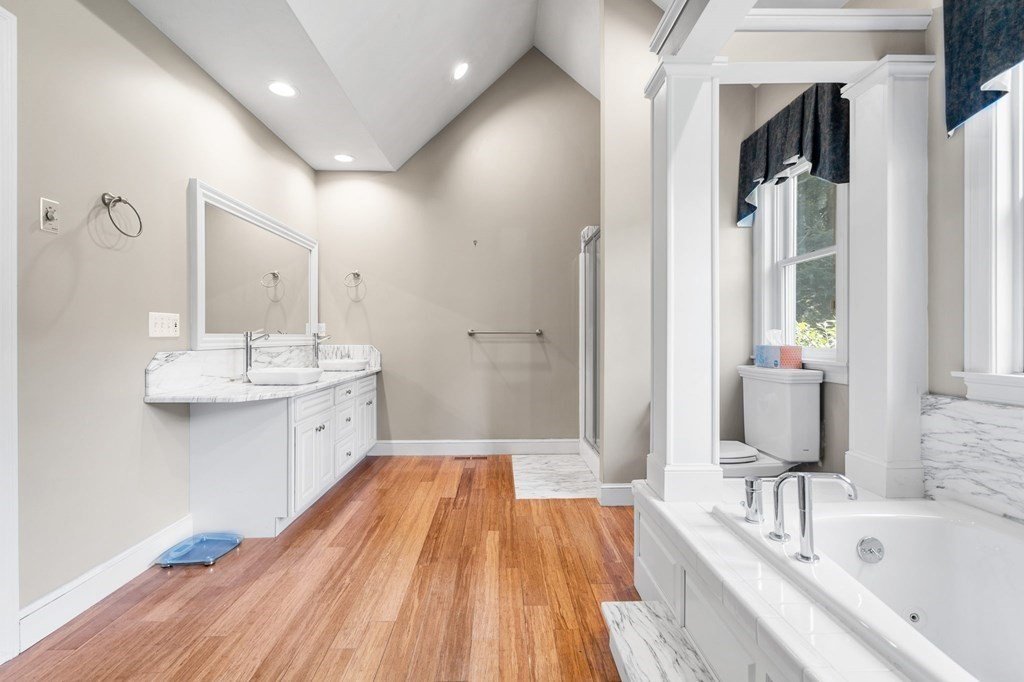 24 Whitney Road Boxford, MA 01921 - Photo 25 of 42 a bathroom with a tub sink and mirror