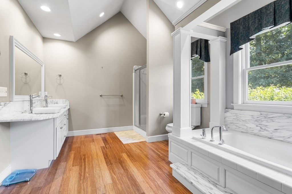 24 Whitney Road Boxford, MA 01921 - Photo 26 of 42 a spacious bathroom with a bathtub and a sink