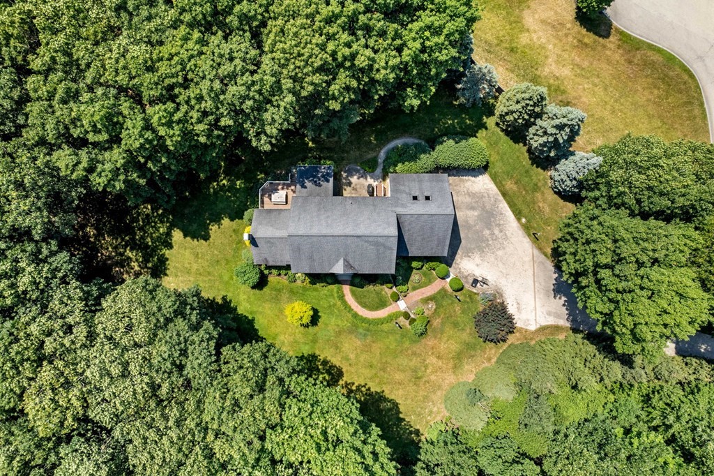24 Whitney Road Boxford, MA 01921 - Photo 3 of 42 an aerial view of a house with swimming pool and large trees