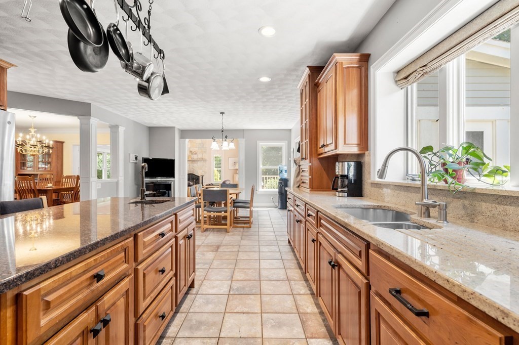 24 Whitney Road Boxford, MA 01921 - Photo 8 of 42 a large kitchen with kitchen island a large counter space a sink and stainless steel appliances