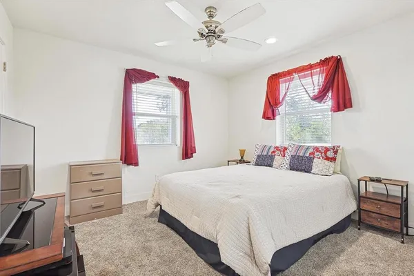 a bedroom with a bed and a dresser