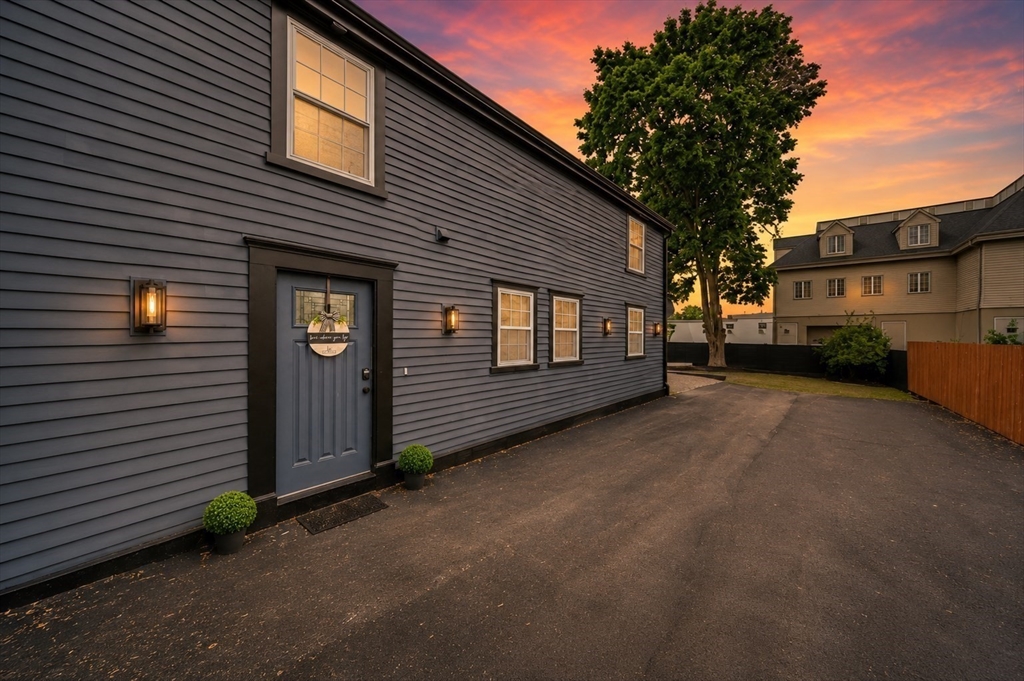 a view of a house with a yard and garage