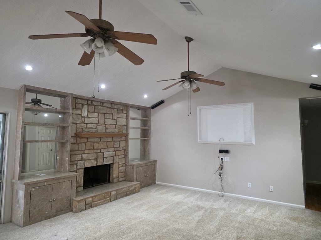 13600 Farm To Market Road 1314 Conroe, TX 77302 - Photo 11 of 26 a view of an empty room with a fireplace