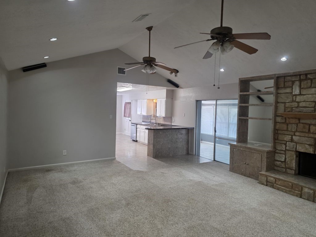 13600 Farm To Market Road 1314 Conroe, TX 77302 - Photo 12 of 26 a view of a kitchen with a sink and a refrigerator
