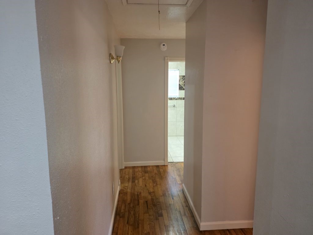 13600 Farm To Market Road 1314 Conroe, TX 77302 - Photo 20 of 26 a view of a room with wooden floor and a small space