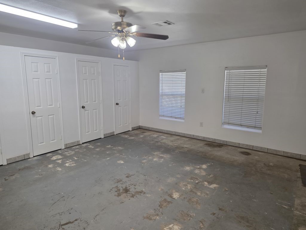 13600 Farm To Market Road 1314 Conroe, TX 77302 - Photo 2 of 26 a view of an empty room with a ceiling fan