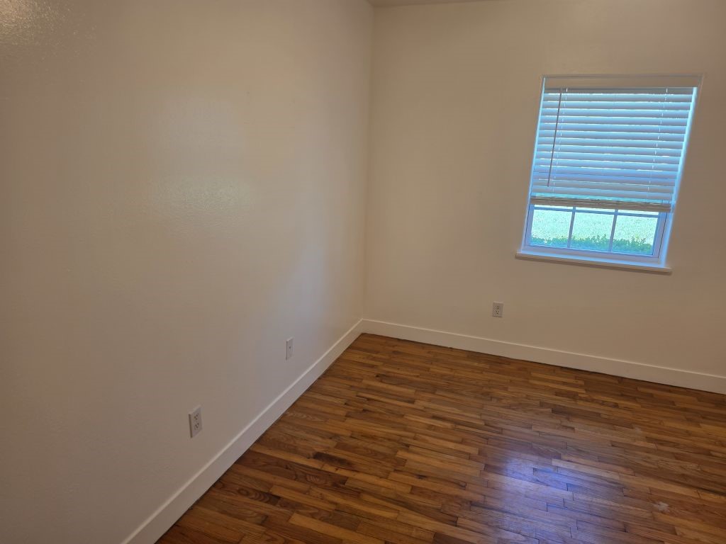 13600 Farm To Market Road 1314 Conroe, TX 77302 - Photo 22 of 26 a view of a room with wooden floor and window