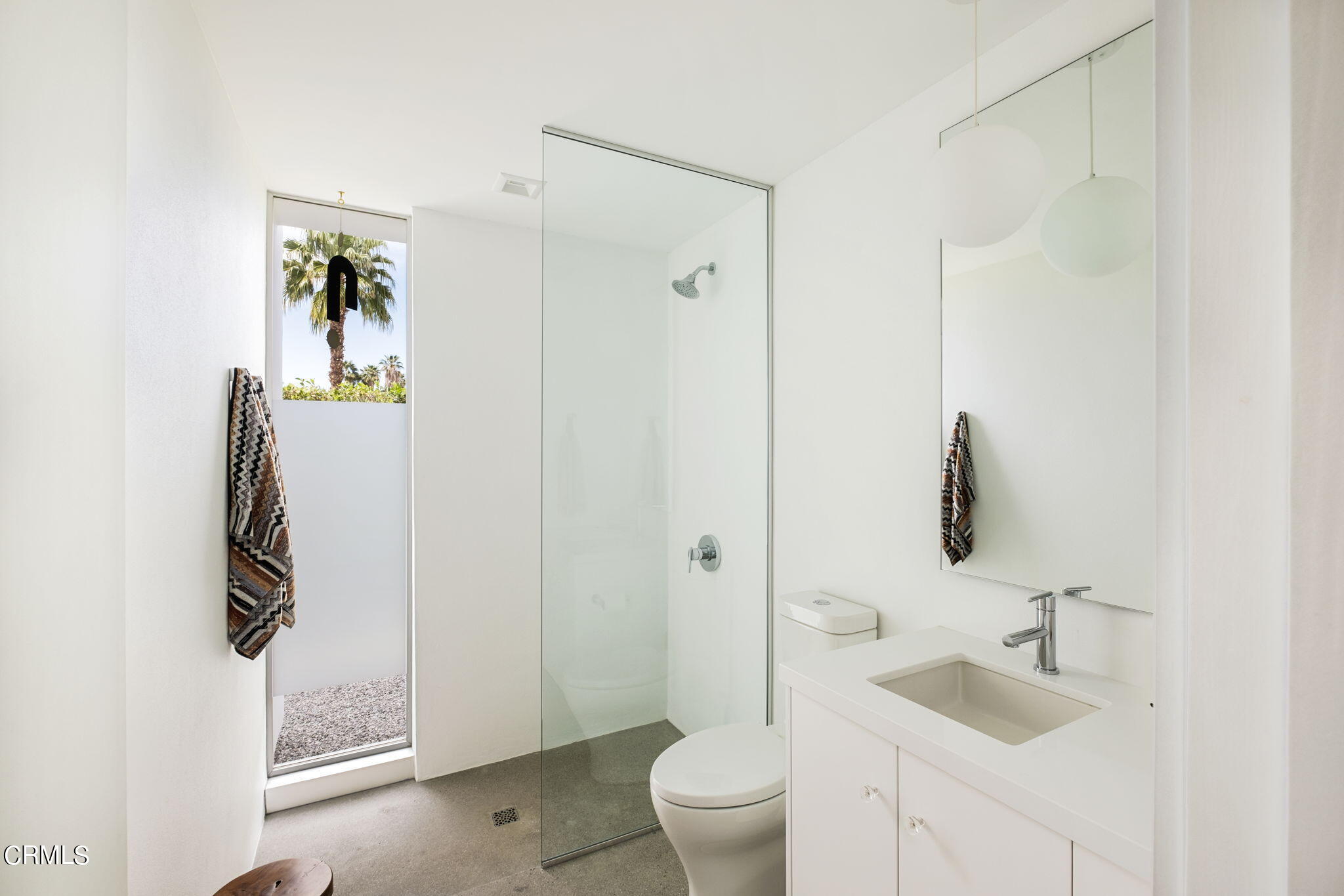 71466 San Gorgonio Road Rancho Mirage, CA 92270 - Photo 22 of 31 a bathroom with a granite countertop sink a toilet and mirror