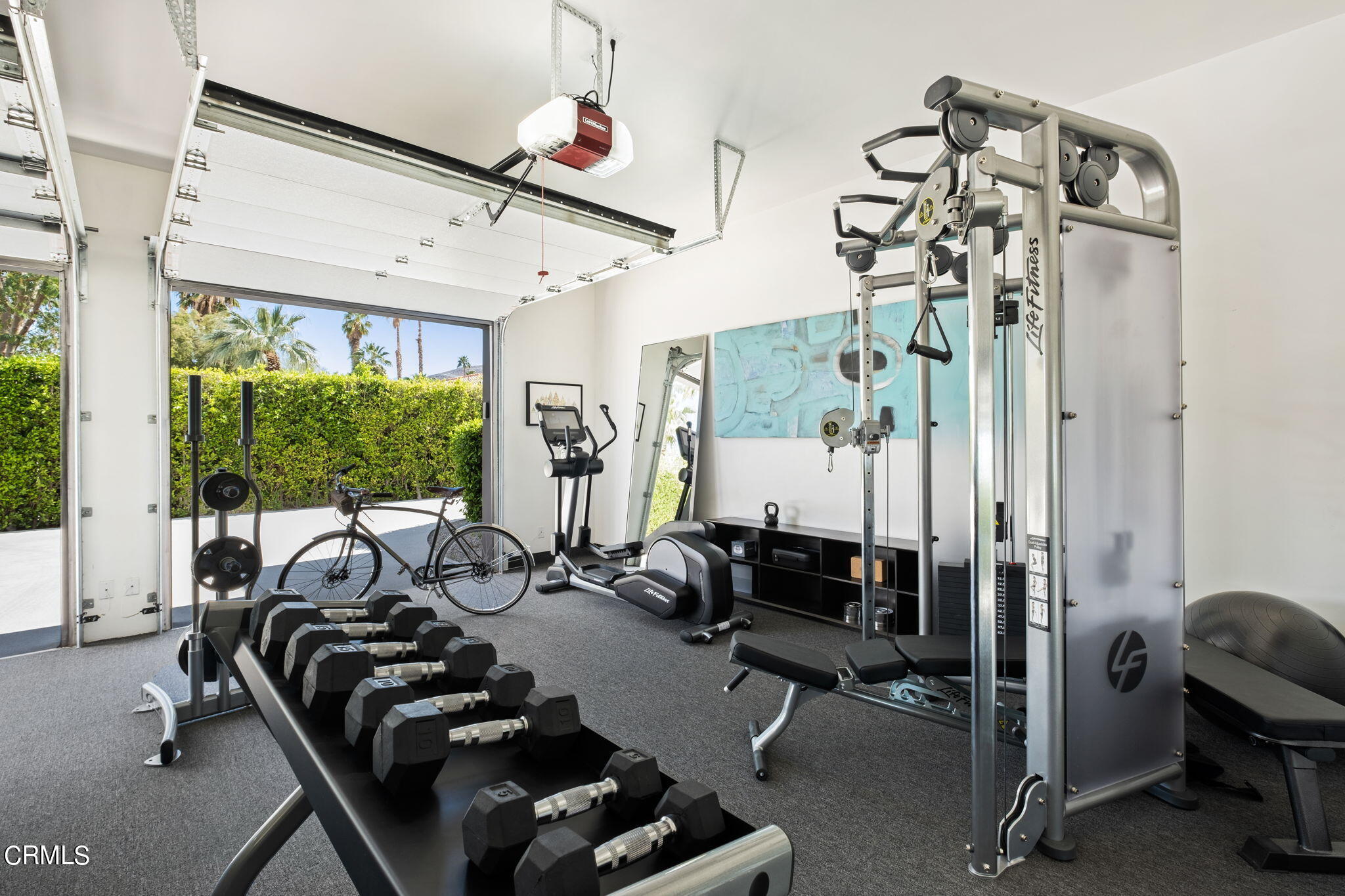 71466 San Gorgonio Road Rancho Mirage, CA 92270 - Photo 26 of 31 a room with gym equipment and a large window