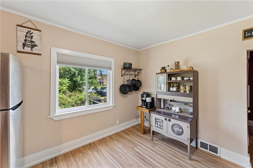 90 Shrader Lane Irwin, PA 15642 - Photo 13 of 39 a view of a livingroom with wooden floor and a window