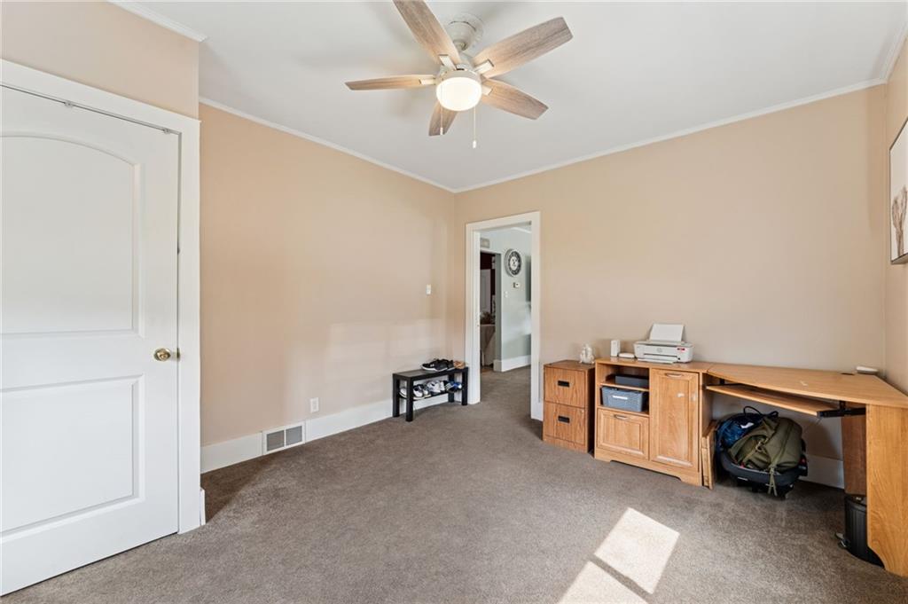 90 Shrader Lane Irwin, PA 15642 - Photo 15 of 39 a view of a livingroom with furniture and a ceiling fan