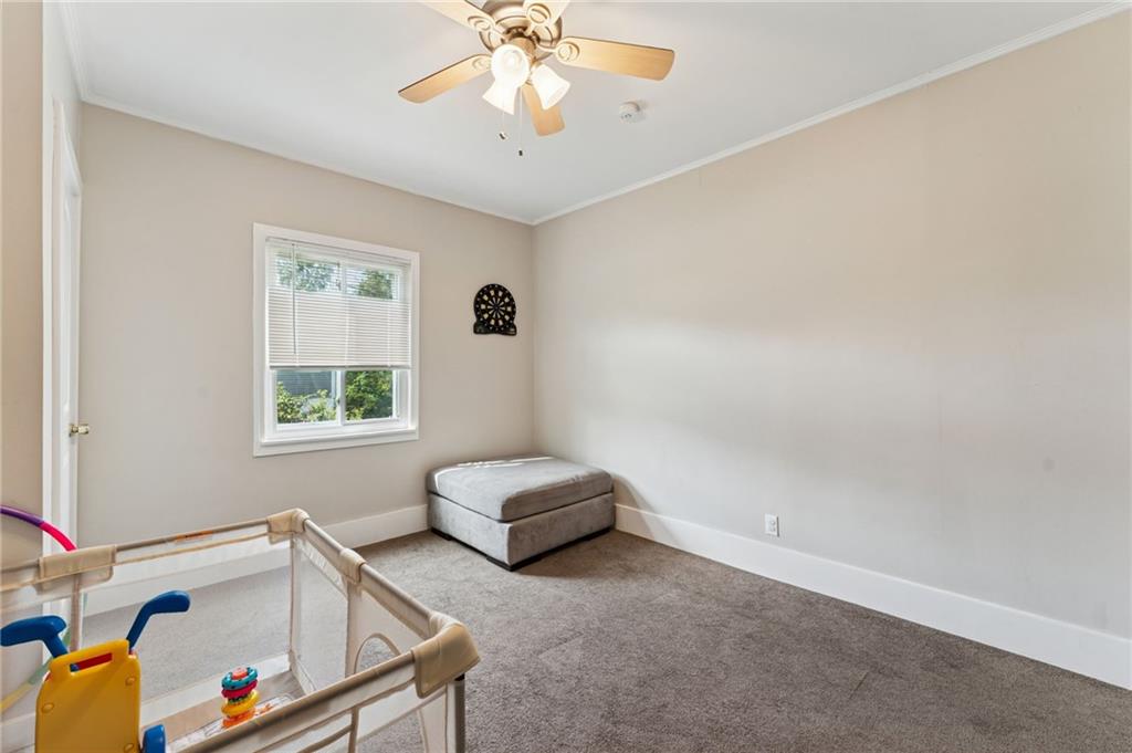 90 Shrader Lane Irwin, PA 15642 - Photo 20 of 39 a living room with furniture and a chandelier