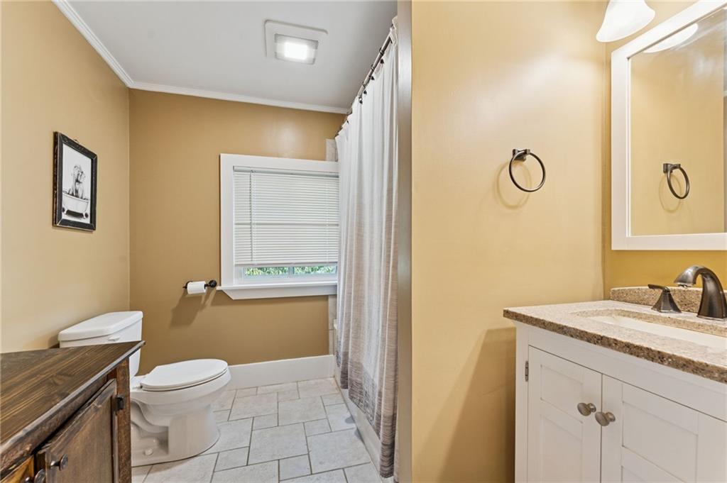 90 Shrader Lane Irwin, PA 15642 - Photo 26 of 39 a bathroom with a granite countertop toilet sink and mirror