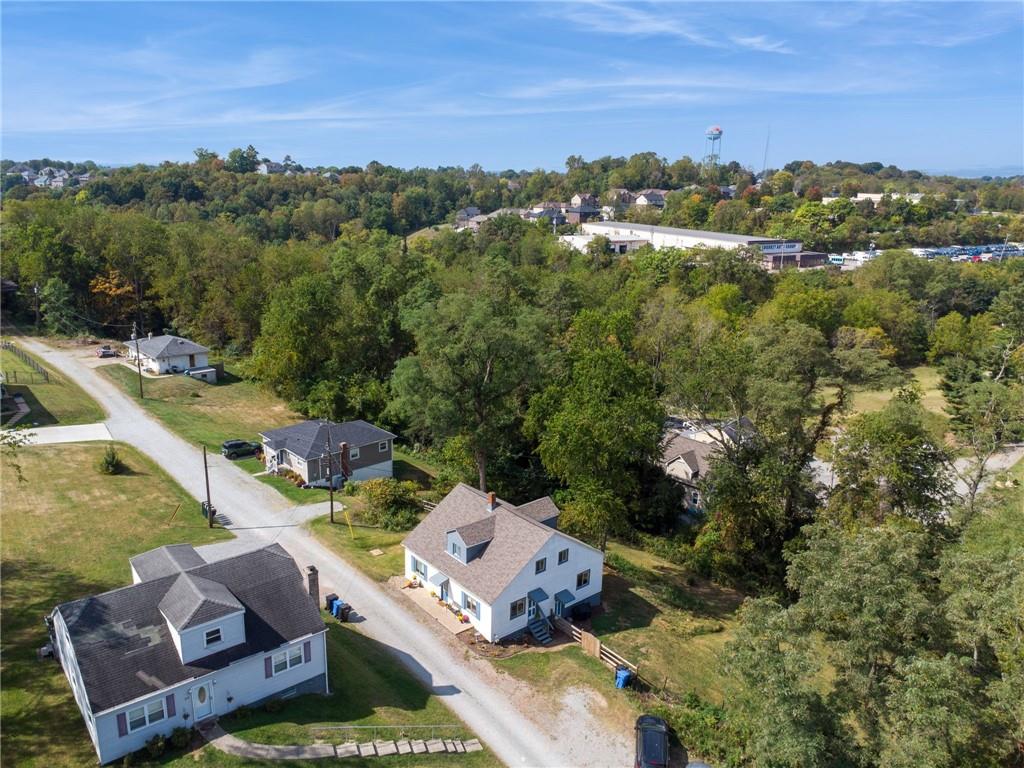 90 Shrader Lane Irwin, PA 15642 - Photo 35 of 39 an aerial view of residential houses with outdoor space