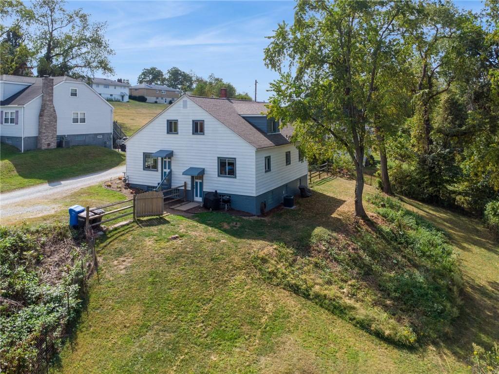 90 Shrader Lane Irwin, PA 15642 - Photo 37 of 39 a view of a house with a yard and sitting area