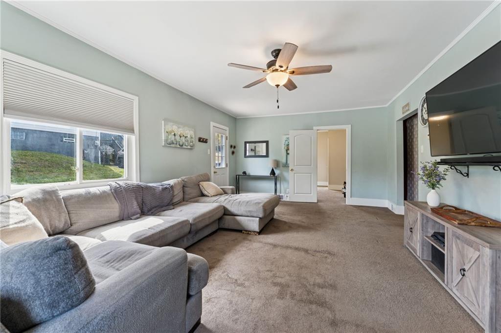 90 Shrader Lane Irwin, PA 15642 - Photo 4 of 39 a living room with furniture and a flat screen tv