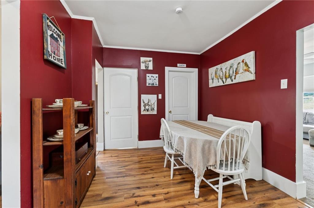 90 Shrader Lane Irwin, PA 15642 - Photo 5 of 39 a view of a dining room with furniture and wooden floor