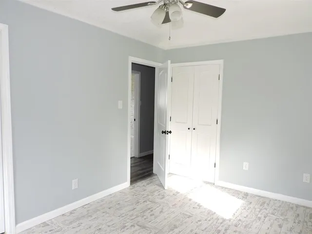 an empty room with fan