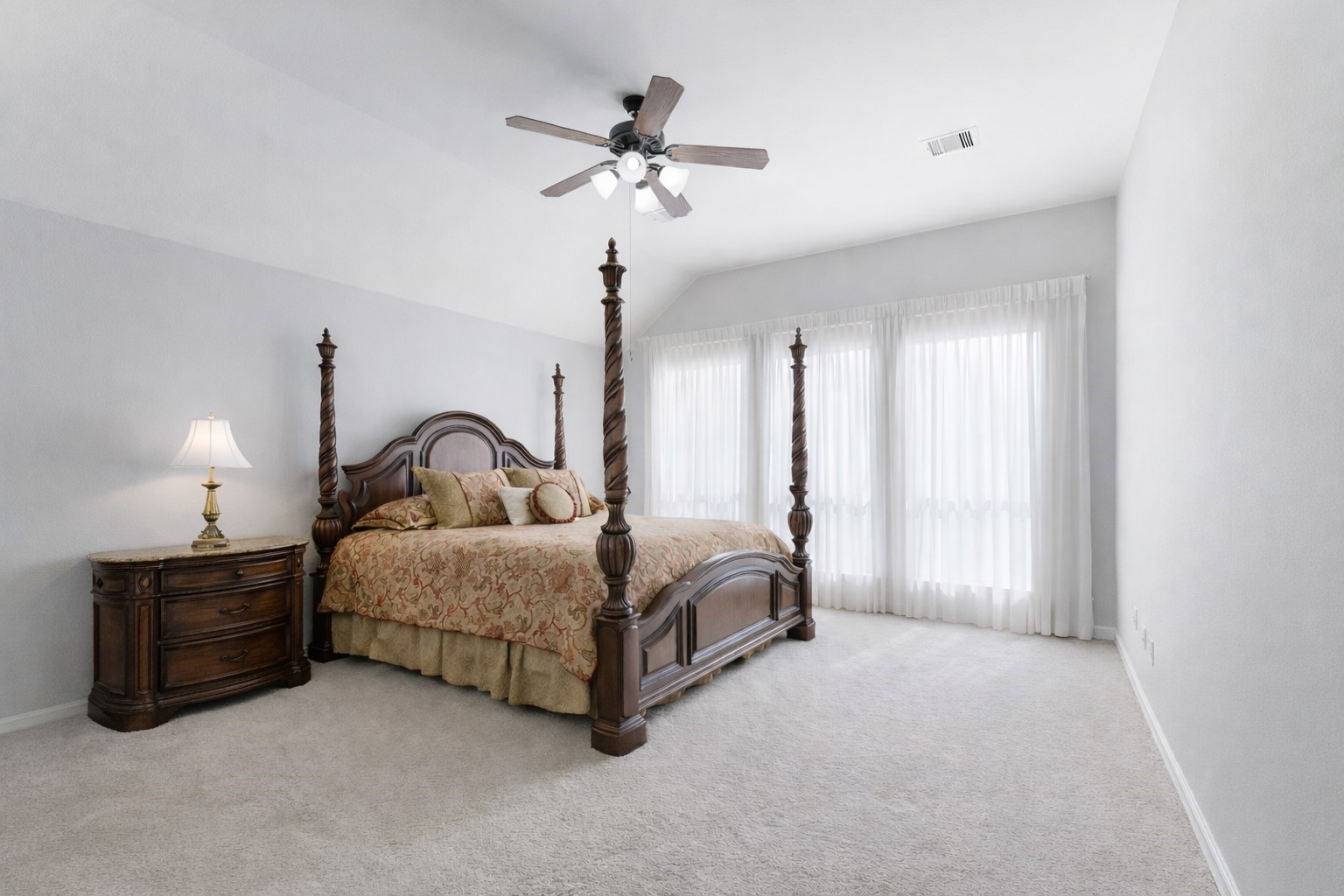 27515 Chris Ridge Court Spring, TX 77386 - Photo 14 of 31 Primary suite is the perfect size for oversized furniture. Enjoy new carpet, neutral paint colors, and lots of light.