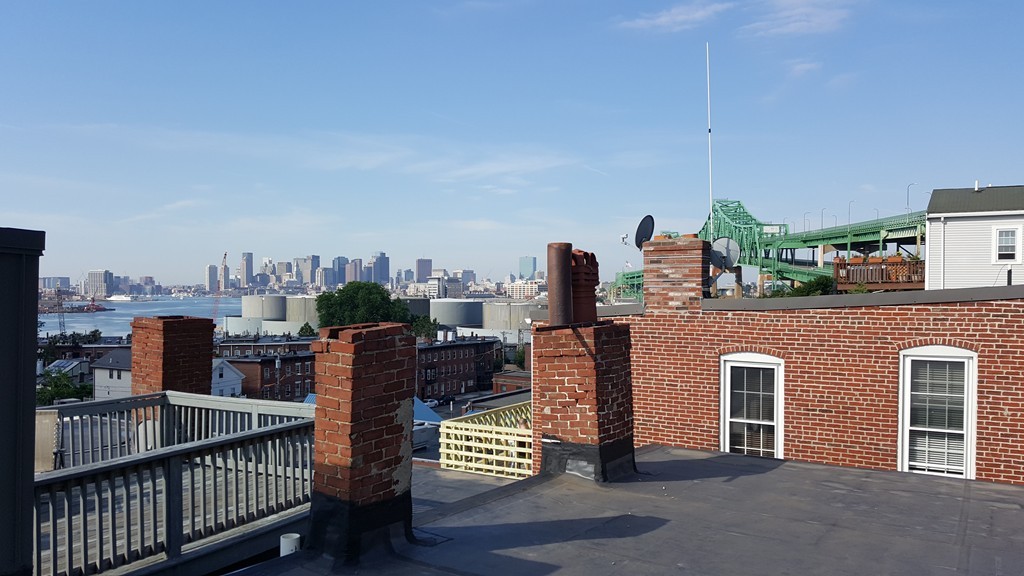 64 Beacon Street Chelsea, MA 02150 - Photo 1 of 10 a view of roof deck with seating space