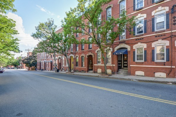 64 Beacon Street Chelsea, MA 02150 - Photo 4 of 10 a view of a building with a street