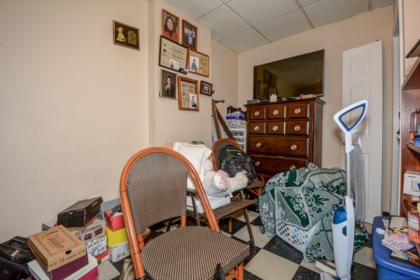 64 Beacon Street Chelsea, MA 02150 - Photo 6 of 10 a view of a workspace with furniture and a flat screen tv