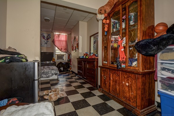 64 Beacon Street Chelsea, MA 02150 - Photo 7 of 10 a living room with furniture and a rug