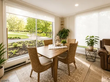 a view of a dining room with furniture window and outside view