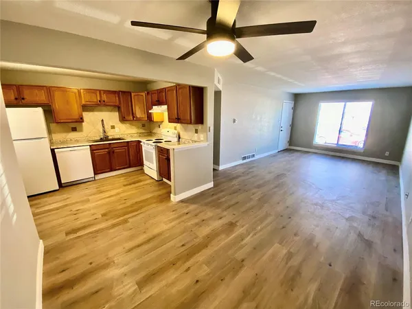 a view of a kitchen with a sink and cabinets