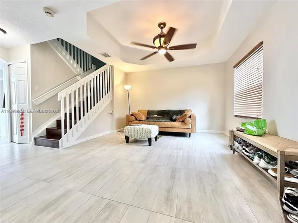 a living room with furniture and a window
