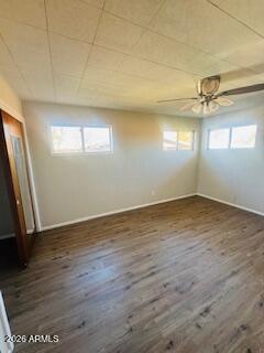 1626 11th Street Douglas, AZ 85607 - Photo 14 of 15 an empty room with wooden floor and windows