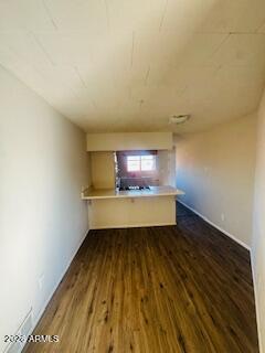 1626 11th Street Douglas, AZ 85607 - Photo 3 of 15 a view of a room with wooden floor and a window