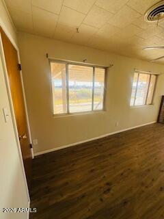 1626 11th Street Douglas, AZ 85607 - Photo 7 of 15 a view of an empty room with wooden floor and a window