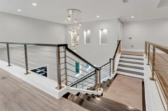 a view of a livingroom with a ceiling fan and window