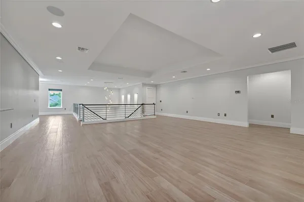 a view of a livingroom with a ceiling fan and window