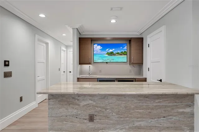 a spacious bathroom with a granite countertop sink a toilet a mirror and shower